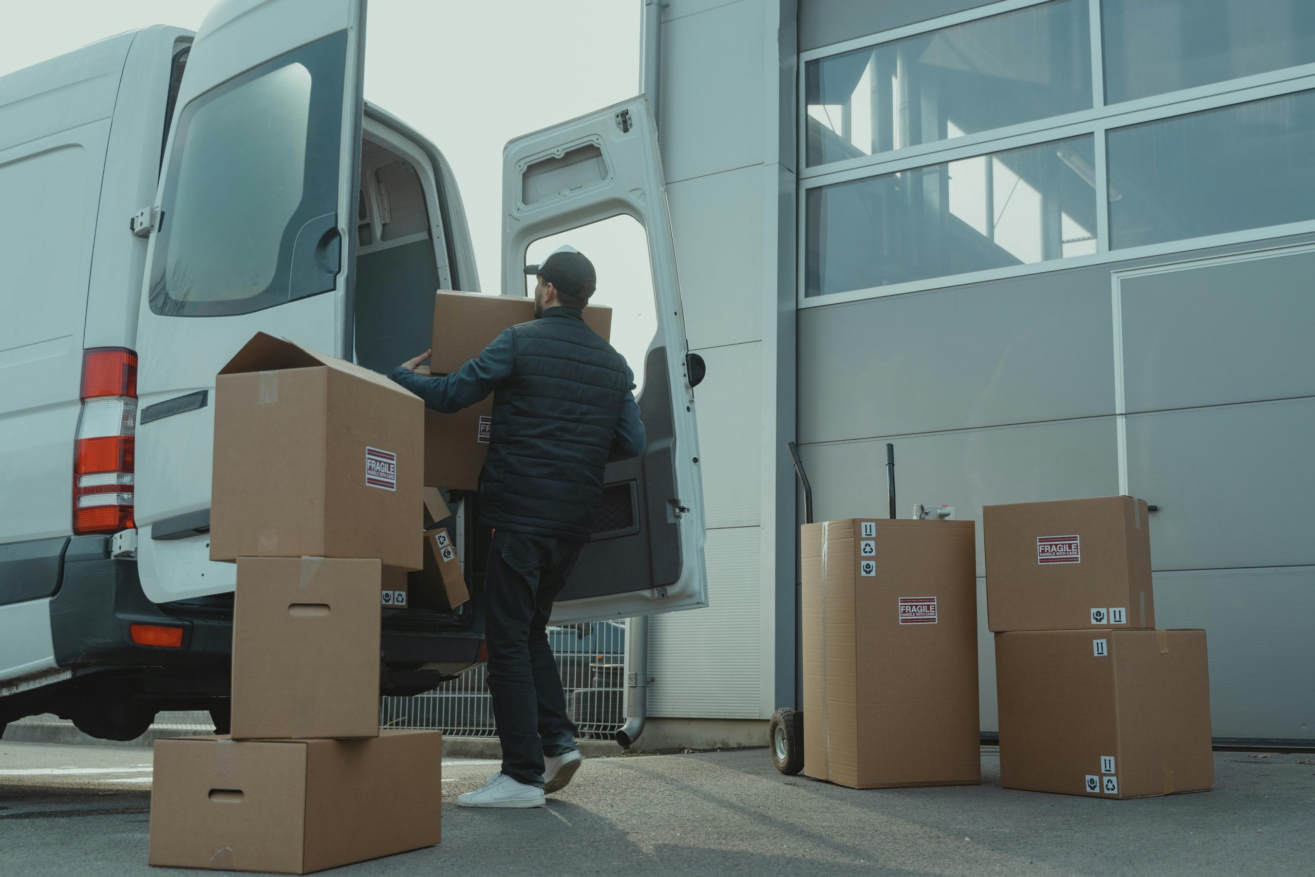 man loading boxes into a cargo van